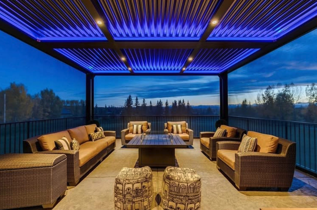 Pergola with rattan lounge seating at dusk